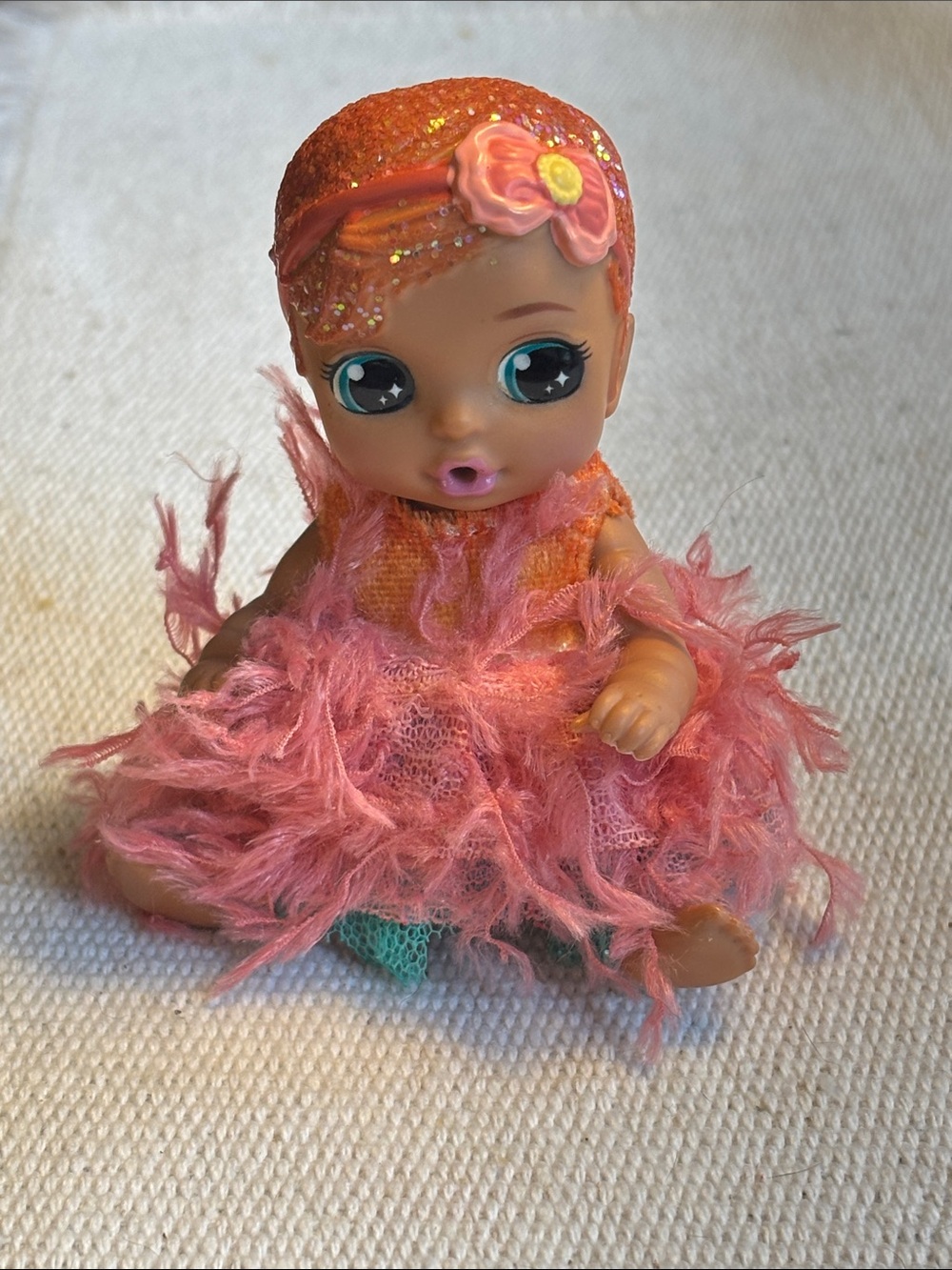 Baby Born Surprise doll orange glitter feather dress